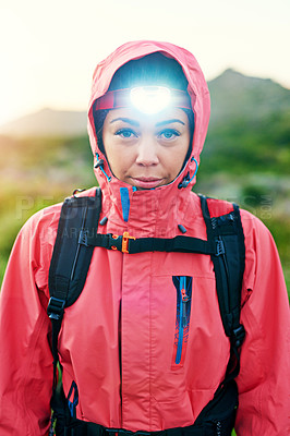 Buy stock photo Portrait of a focused young woman out for a run on a cool morning