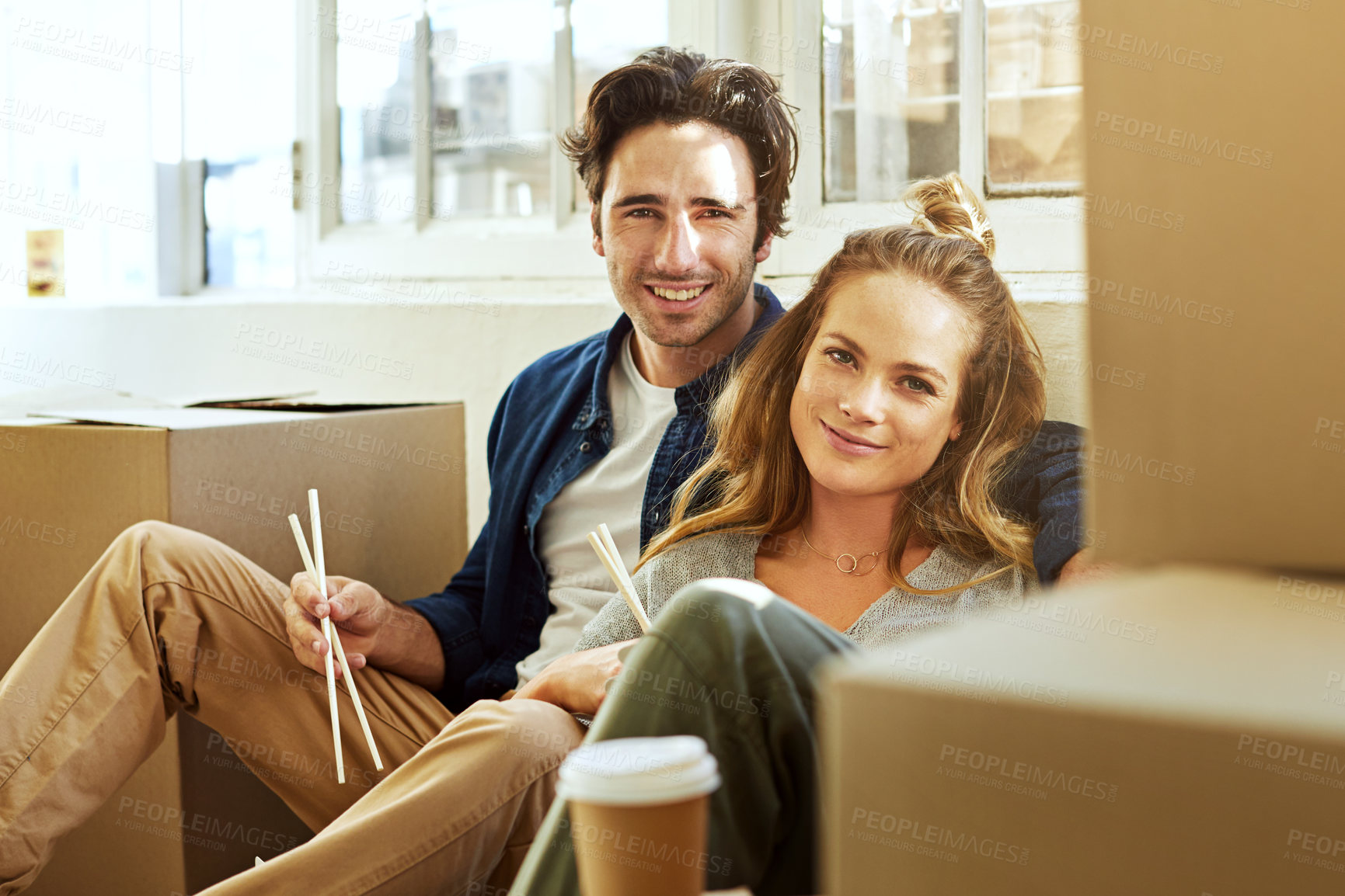 Buy stock photo Portrait, moving day and fast food with couple in new home together for fresh start or relocation. Boxes, takeaway and property investment with people in apartment for bonding, rest and eating