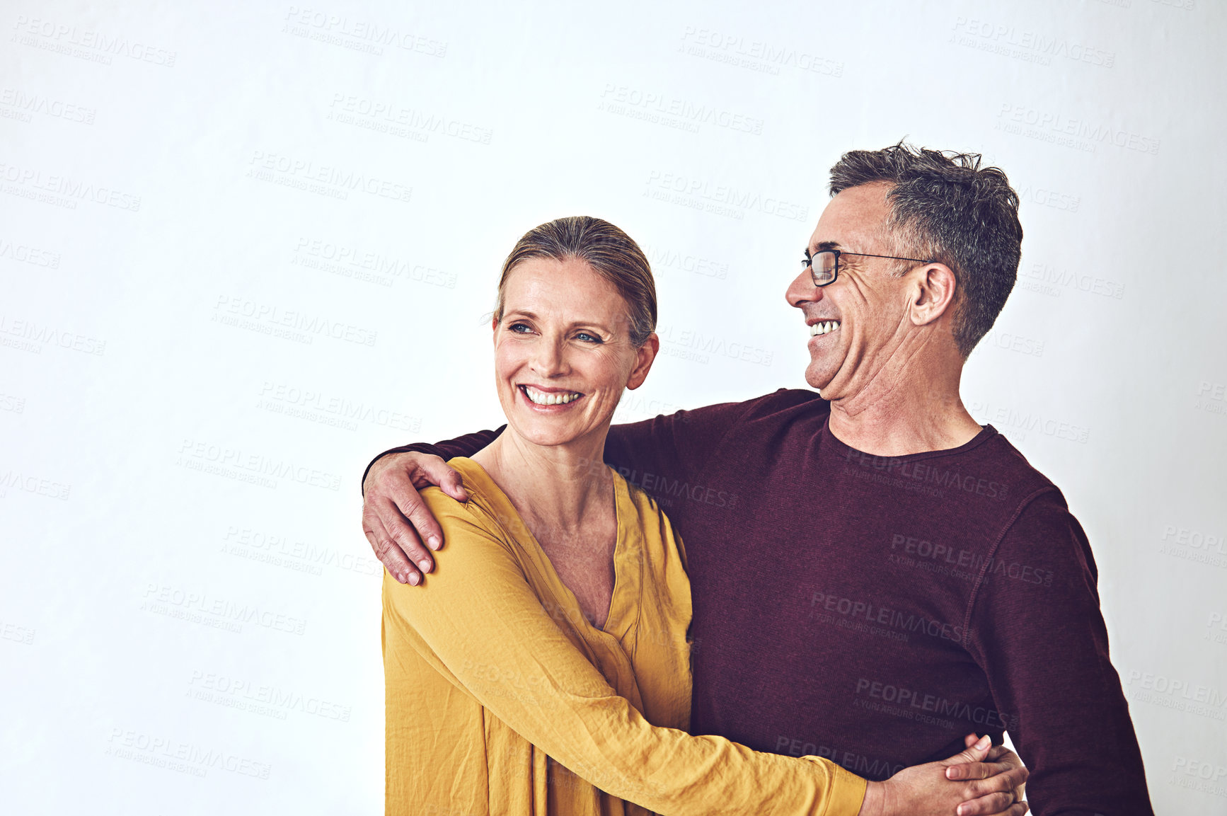Buy stock photo Love, space and laughing with couple and hug for connection, bonding and loyalty. Marriage commitment, care and partner with mature man and woman on white background for support, funny and trust