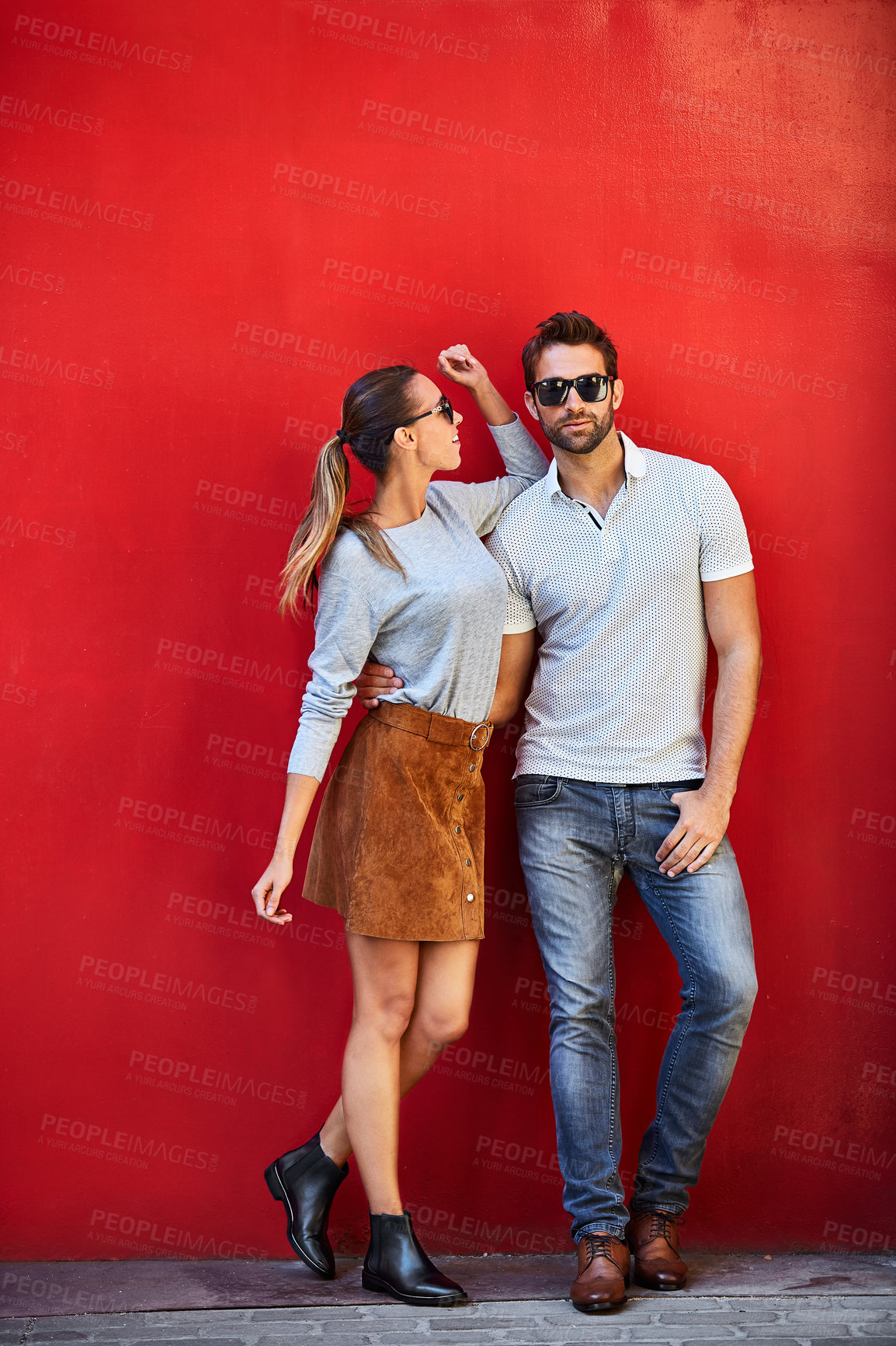 Buy stock photo Fashion, casual or couple on wall with sunglasses, basic aesthetic or simple outfit in relaxed wear. Space, eyewear and people with smile, comfortable clothes and confident style in outdoor attire.