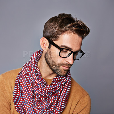 Buy stock photo Studio shot of a handsome young man posing against a gray background