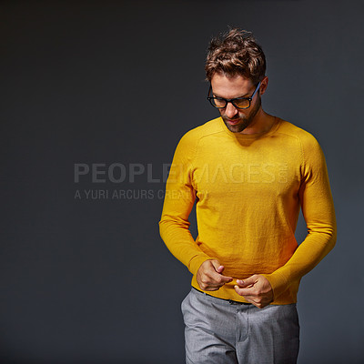 Buy stock photo Studio shot of a handsome young man posing against a gray background