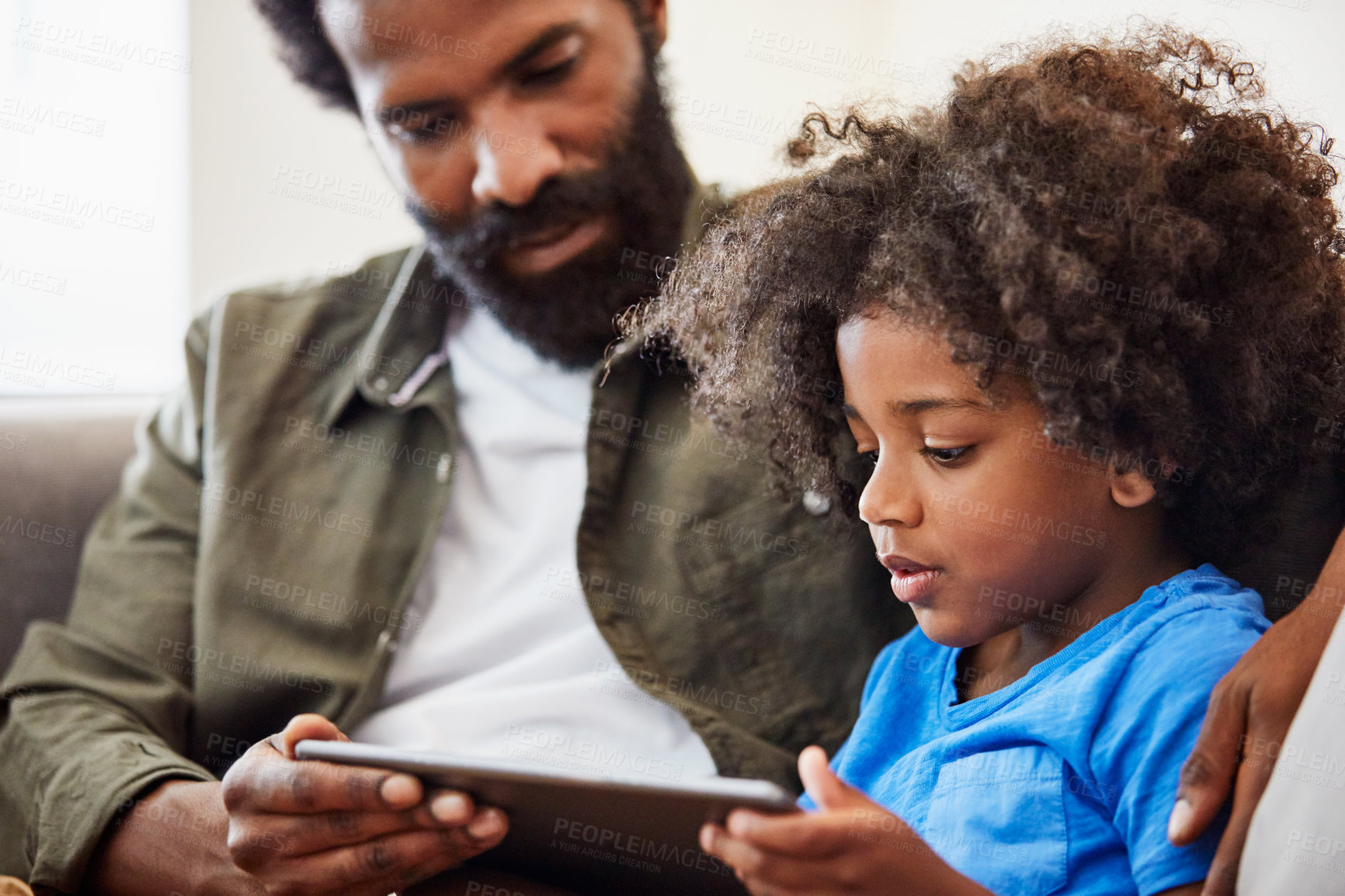 Buy stock photo Father, child and reading with tablet in family home for language, elearning and online lesson. Black man, son and together in house for tech, literacy or kids video on education app for development