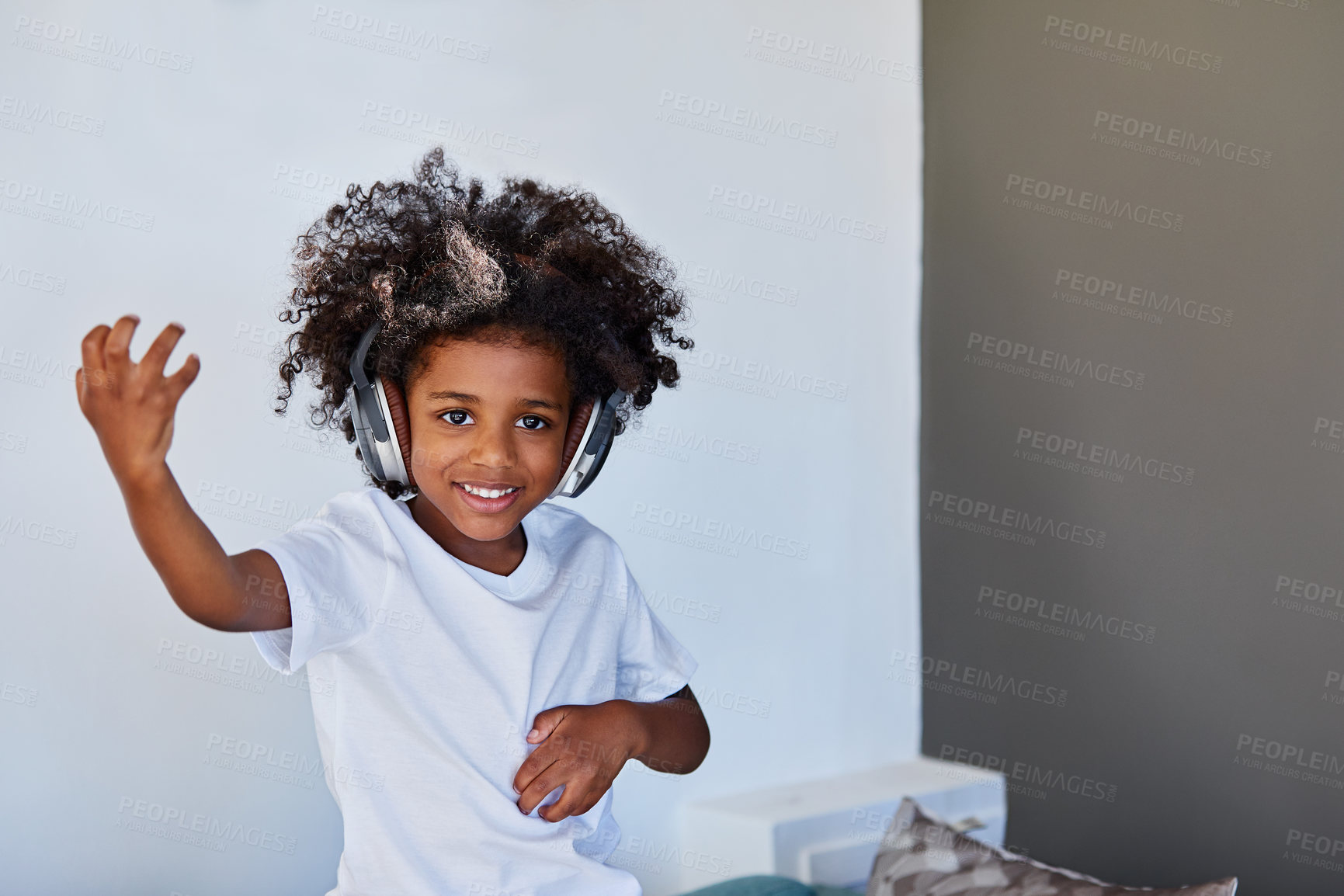 Buy stock photo Smile, child and dance in home with headphones, pretend musician and music for imaginary concert. Portrait, kid and playing air guitar with space, rock star fantasy and song for musical performance