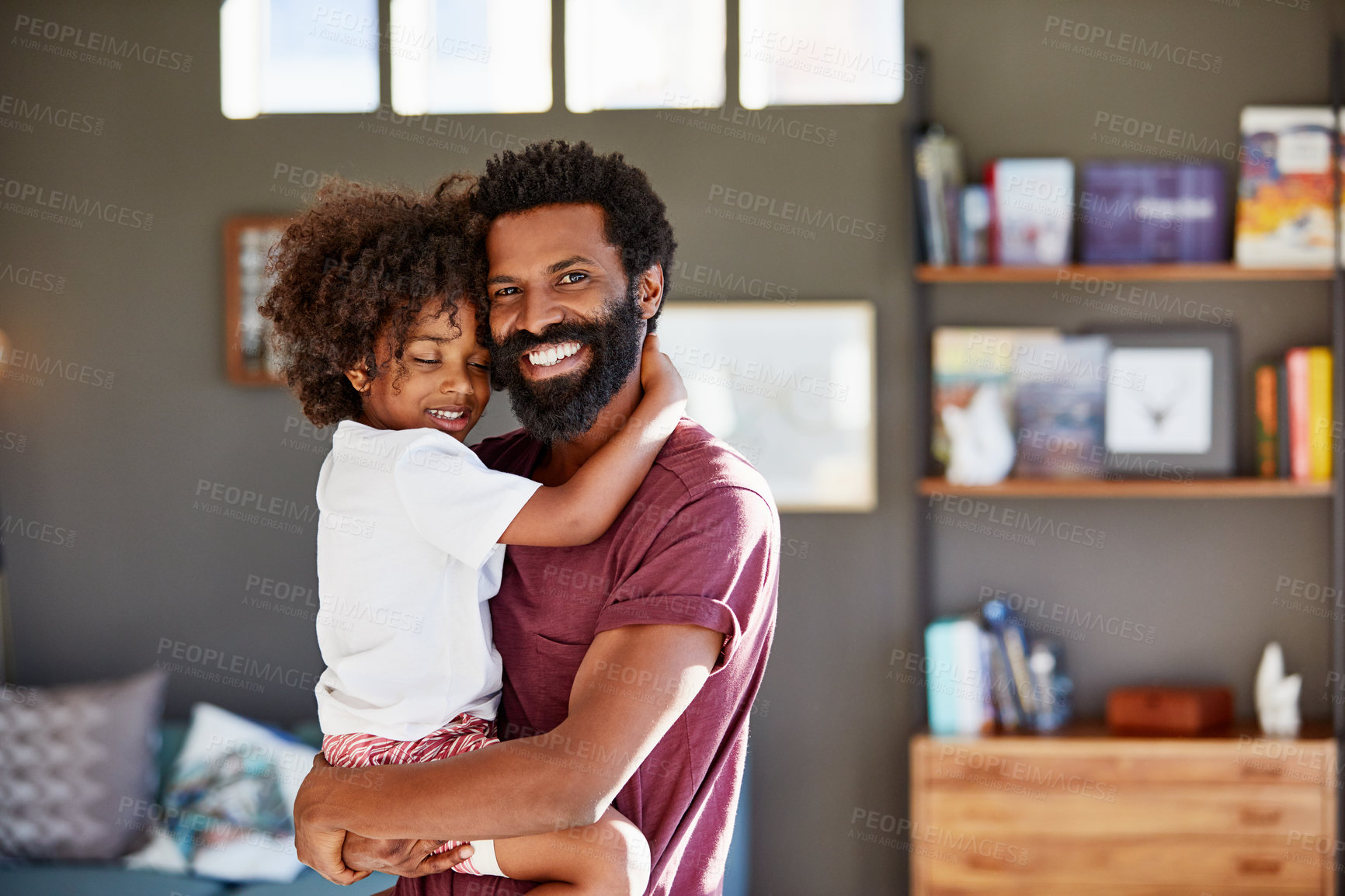 Buy stock photo Father, child and happy for hug in family home with bonding, wellness and care or connection. Black man, son and together in house for support, security and healthy relationship or smile portrait