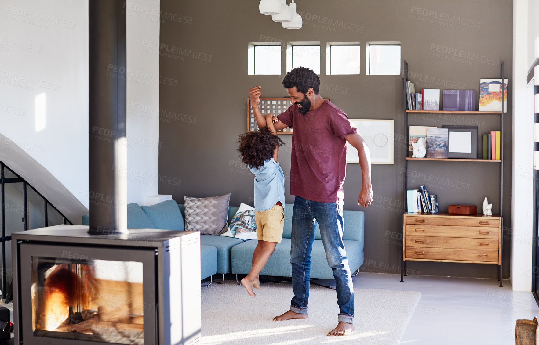 Buy stock photo Games, father and kid with hanging in house, bonding and connection with strong in living room. Black man, boy and muscle with happiness together, playful quality time and fun in family home