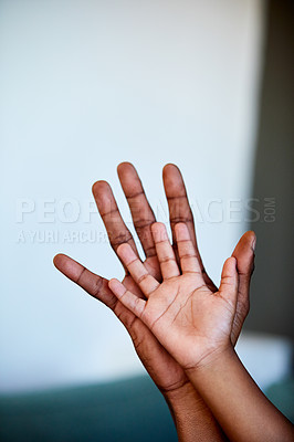 Buy stock photo Shot of two unrecognizable people's hands right next to each other with the one being bigger than the other