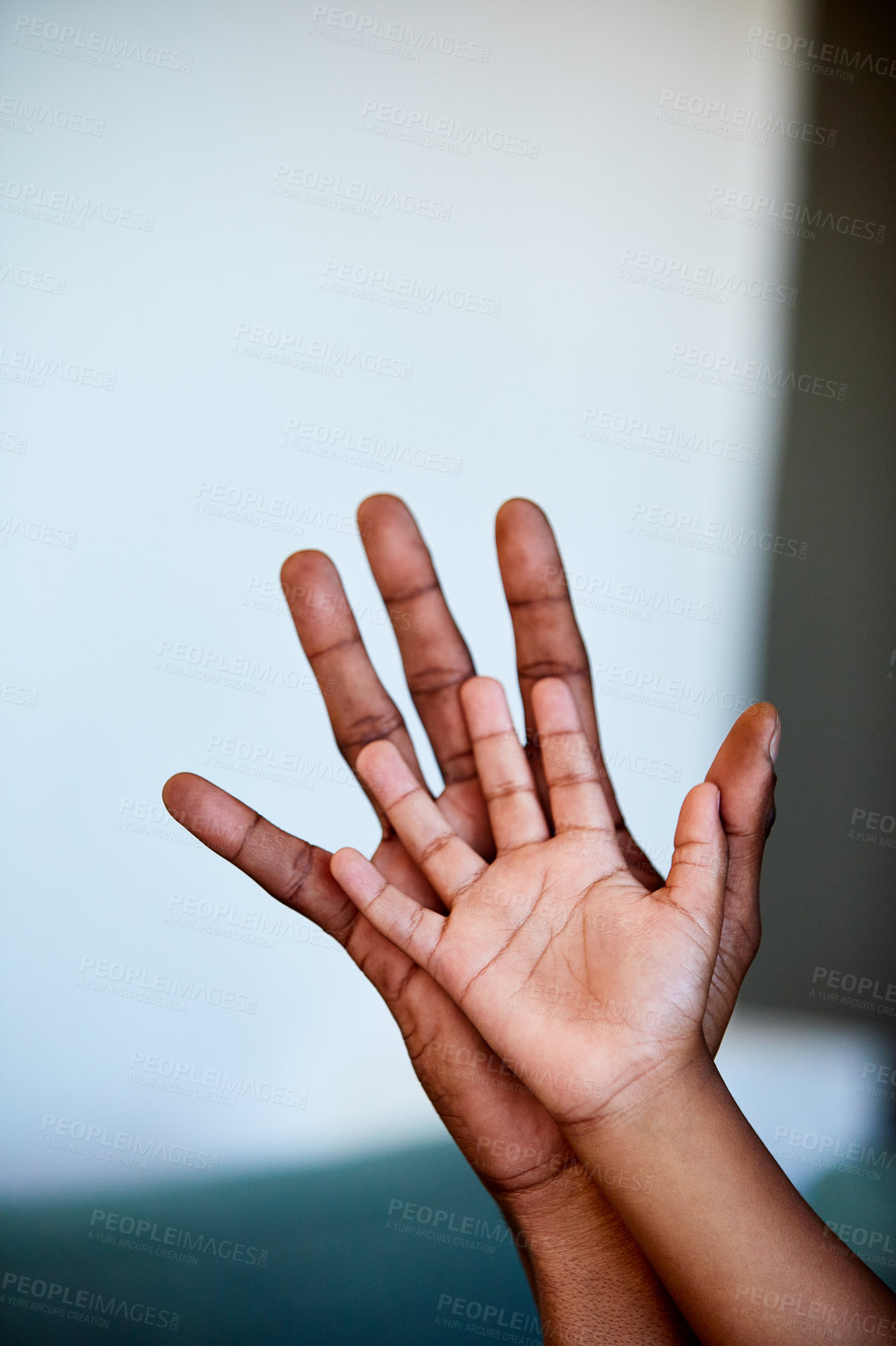 Buy stock photo Shot of two unrecognizable people's hands right next to each other with the one being bigger than the other