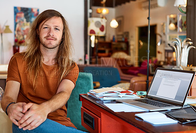 Buy stock photo Portrait of a young man sitting at his desk in an office