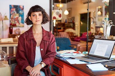Buy stock photo Cropped portrait of an attractive young woman sitting at her desk in an office