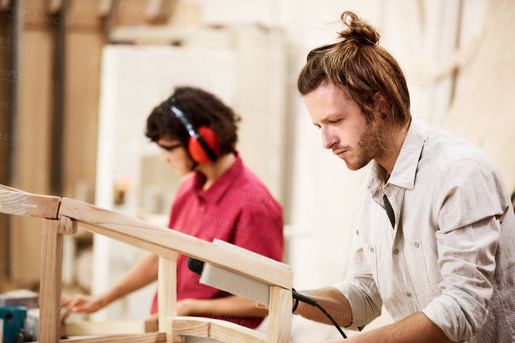 Buy stock photo Carpenter, wood and team with people in workshop for furniture, antique restoration and project. Contractor craftsman, manufacturing and woodworking with man and woman in factory for labor partner