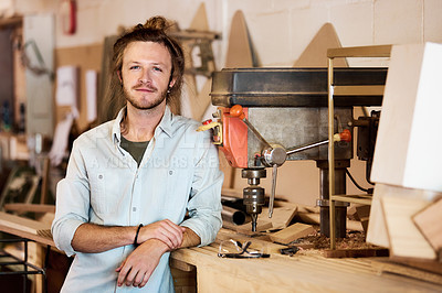 Buy stock photo Portrait of a handsome young man standing in a furniture manufacturing workshop
