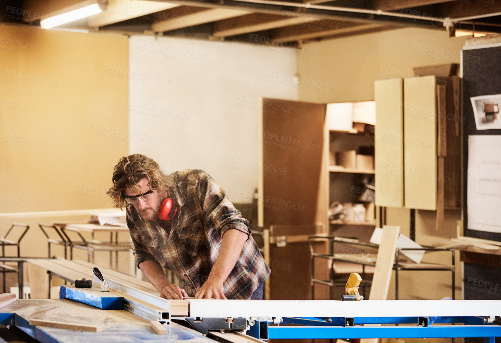 Buy stock photo Workshop, carpenter and man with wood for measurement, accuracy and quality for lumber project. Carpentry, ppe and person with plank for furniture dimension, timber production and woodworking service