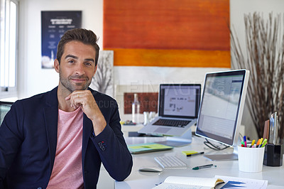 Buy stock photo Portrait of a handsome businessman sitting at his desk