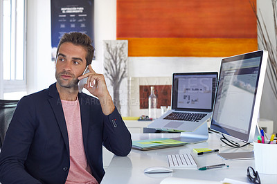 Buy stock photo Shot of a businessman using his cellphone in his office