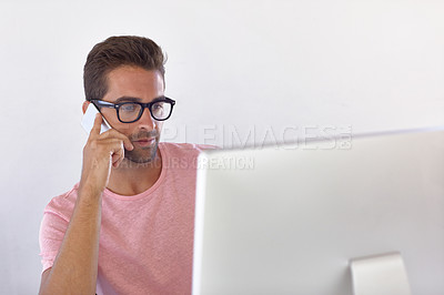 Buy stock photo Shot of a businessman using his cellphone in his office