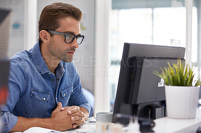 Buy stock photo Cropped shot of a businessman working on his computer