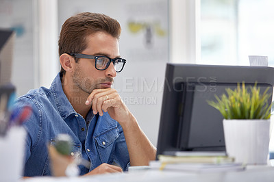 Buy stock photo Cropped shot of a businessman working on his computer