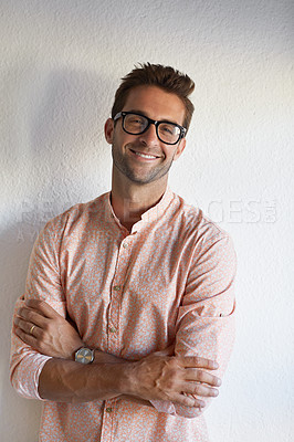 Buy stock photo Cropped shot of a handsome young businessman posing against a white wall