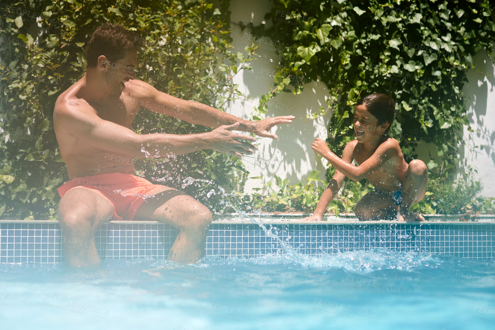 Buy stock photo Game, splash and father with son at swimming pool for summer vacation, bonding and connection. Happy, aquatic playful and relax with man and child in backyard of family home for care and holiday