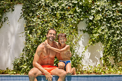 Buy stock photo Portrait of a father and his son enjoying a day by the swimming pool