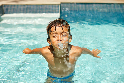 Buy stock photo Shot of a little boy swimming in a pool