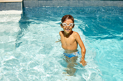 Buy stock photo Shot of a little boy swimming in a pool