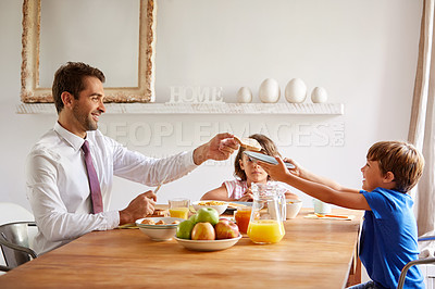 Buy stock photo Cropped shot of a young family having breakfast together at home