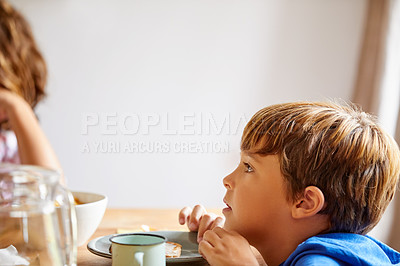 Buy stock photo Cropped shot of siblings having breakfast together at home