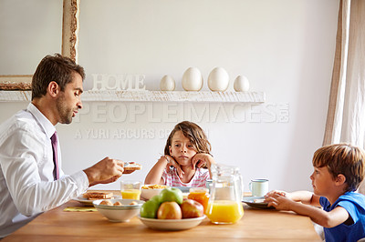 Buy stock photo Cropped shot of a young family having breakfast together at home