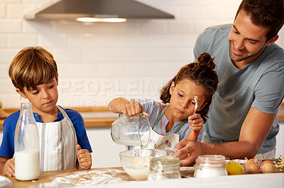 Buy stock photo Cropped shot of a father helping his son and daughter bake in the kitchen at home