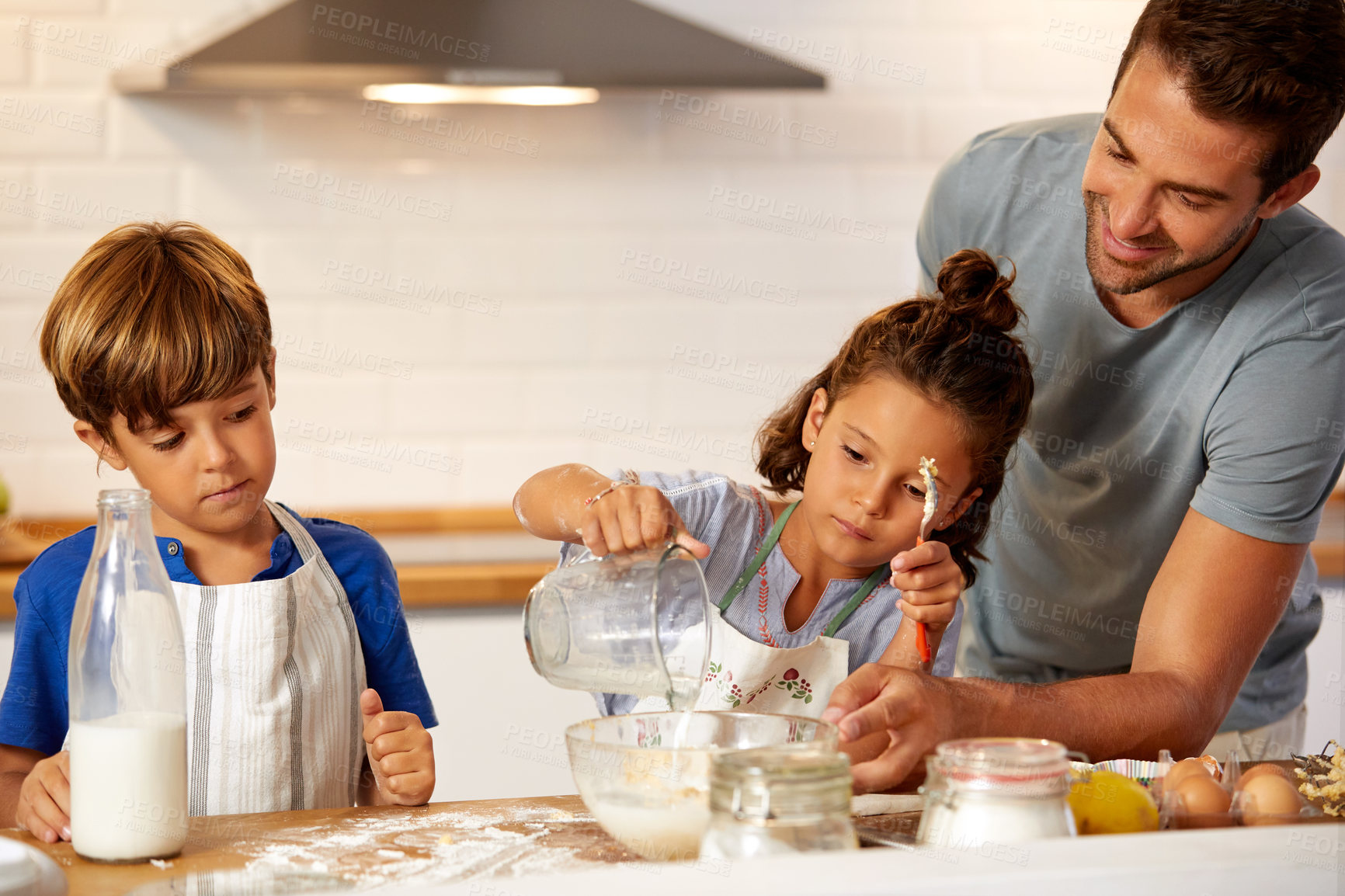 Buy stock photo Baking, parent and kids in kitchen with support, home bonding and connection in learning to cook. Help, father and children with dessert prep, happy moment and child development in family activity.