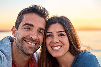 Buy stock photo Portrait of a happy young couple enjoying some time together outdoors