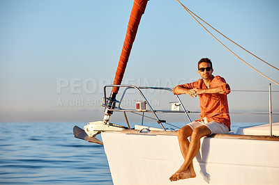 Buy stock photo Portrait of a young man going for an ocean cruise on a boat