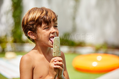 Buy stock photo Shot of an adorable little boy having going for a swim on a summer's day