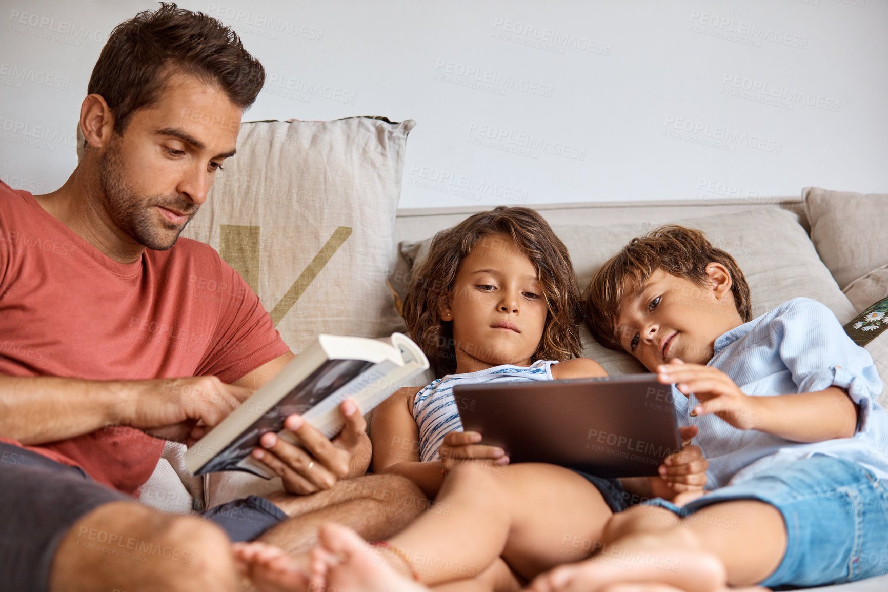Buy stock photo Dad, kids and book with tablet on sofa for weekend break, entertainment or holiday together. Father, children or siblings with technology, story or novel on couch for connection or learning in house