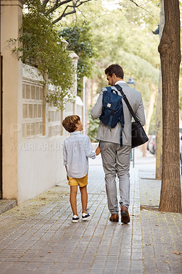 Buy stock photo Shot of a businessman walking his son to school