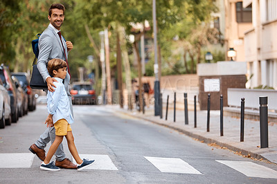 Buy stock photo Shot of a businessman walking his son to school