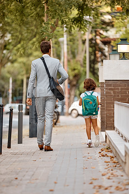 Buy stock photo Shot of a businessman walking his daughter to school