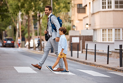 Buy stock photo Shot of a businessman walking his son to school