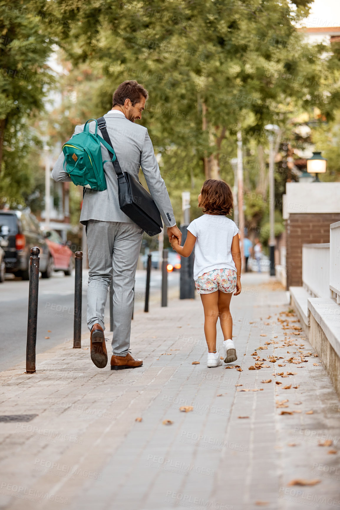 Buy stock photo Shot of a businessman walking his daughter to school
