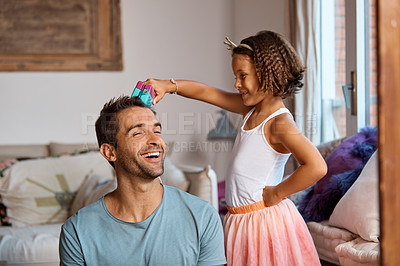 Buy stock photo Shot of a little girl doing her father's hair