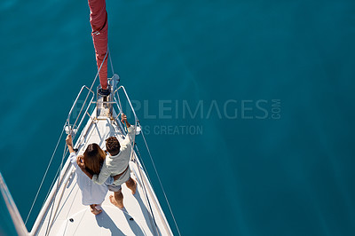 Buy stock photo High angle shot of an affectionate young couple enjoying a yacht cruise