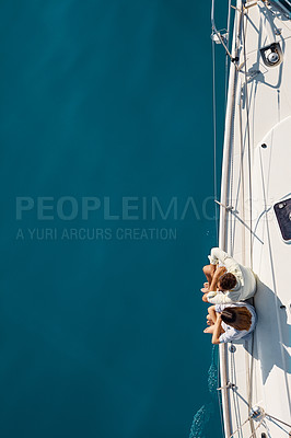 Buy stock photo High angle shot of an affectionate young couple enjoying a yacht cruise