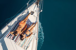 Tanning on their yacht