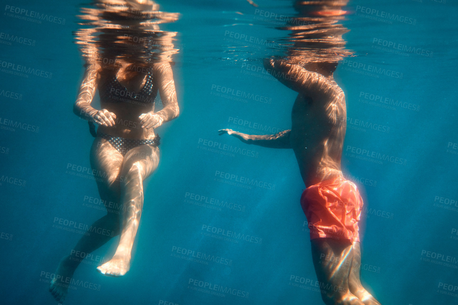 Buy stock photo Holiday, sea and swimming with couple underwater together for bonding, dating or love in summer. Hobby, travel and vacation with swimmer people in ocean with body, security or weekend getaway