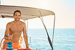 Happy to be the captain of his own yacht