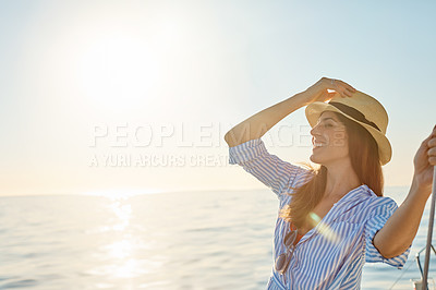 Buy stock photo Shot of a beautiful young woman going for an ocean cruise on a boat