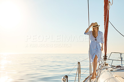 Buy stock photo Shot of a beautiful young woman going for an ocean cruise on a boat