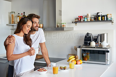 Buy stock photo Shot of a young couple having a relaxing breakfast together at home